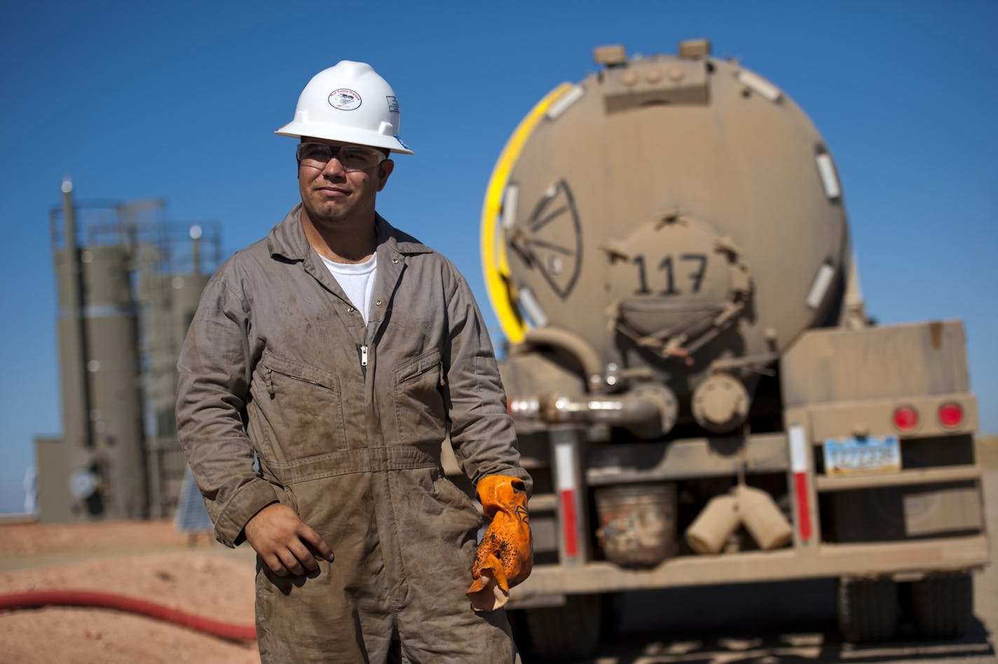 Kenny LeBaron of Minneapolis drives a truck with his younger brother Joshua. They moved to North Dakota to take advantage of the much higher salaries due to the oil boom. Here they removed waste saltwater from a new Kodiak Gas & Oil well near Watford City, North Dakota. ] GLEN STUBBE * gstubbe@startribune.com EDS: names are cq from subjects.