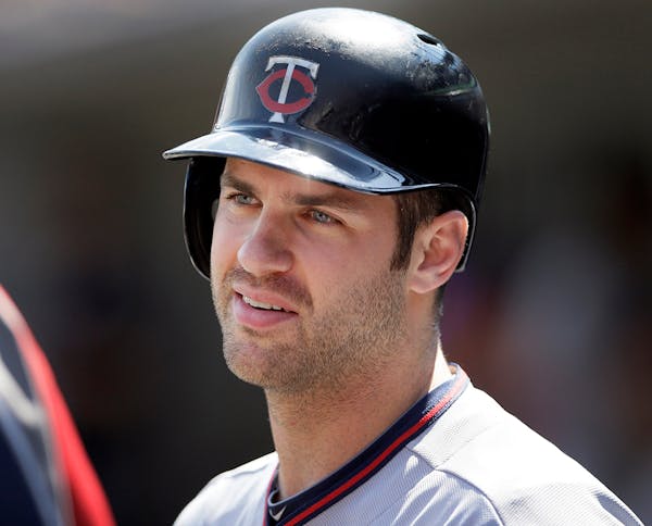 Twins first baseman Joe Mauer hinted Sunday that the back injury that cost him five games in early May was serious and lingering.
