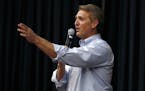 FILE- In this April 13, 2017, file photo, Arizona Republican Sen. Jeff Flake takes a question from the audience during a town hall in Mesa, Ariz. The 