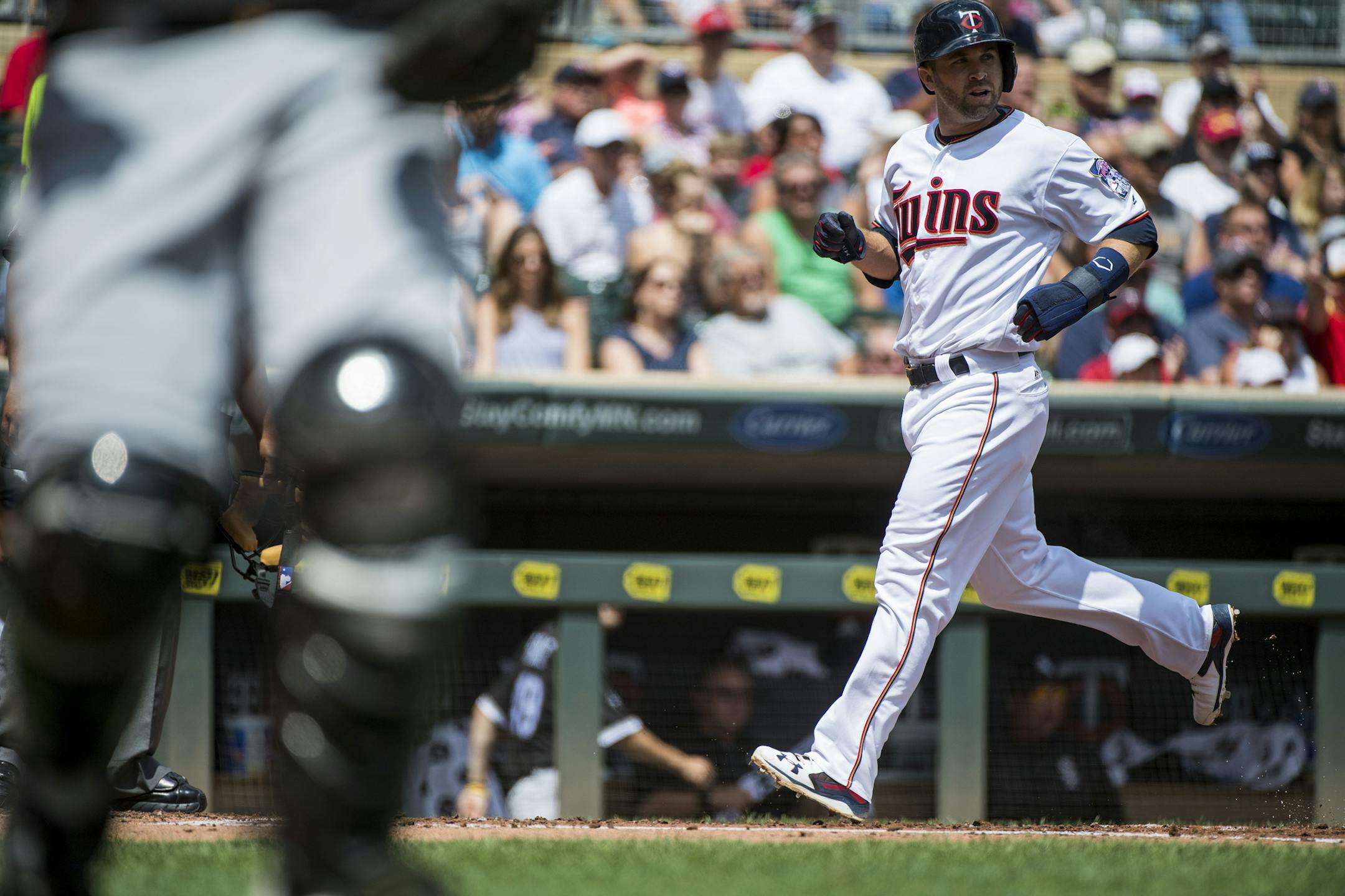 Minnesota Twins second baseman Brian Dozier (2) looked towards first base as he crossed the plate for a run off a single from Robbie Grossman to bring the score 1-0 in the first inning at Target Field on Sunday. ] Isaac Hale &#x2022; isaac.hale@startribune.com The Minnesota Twins played the Chicago White Sox at Target Field in Minneapolis, MN, on Sunday, July 31, 2016.