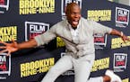 Terry Crews jumps in the air as he arrives at An Evening With "Brooklyn Nine-Nine" at Bing Theatre on Thursday, May 7, 2015, in Los Angeles.(Photo by 
