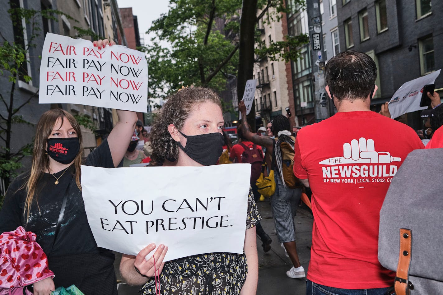 Unionized workers from CondeŽ Nast and their supporters protest outside Anna Wintour's home in Greenwich Village on Tuesday, June 8, 2021. After more than two years of negotiations with the magazineÕs parent company, CondŽ Nast, more than 100 demonstrators marched on the editorial directorÕs quiet block. (John Taggart/The New York Times)