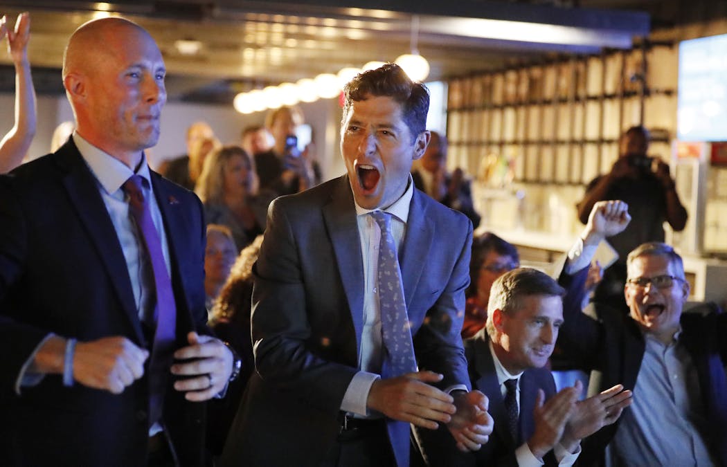 Minneapolis Mayor Jacob Frey, center, celebrated with Matt Meunier, left, director of Sports Minneapolis, and University of Minnesota athletic director Mark Coyle, right, after the news about the 2022 women's Final Four was announced