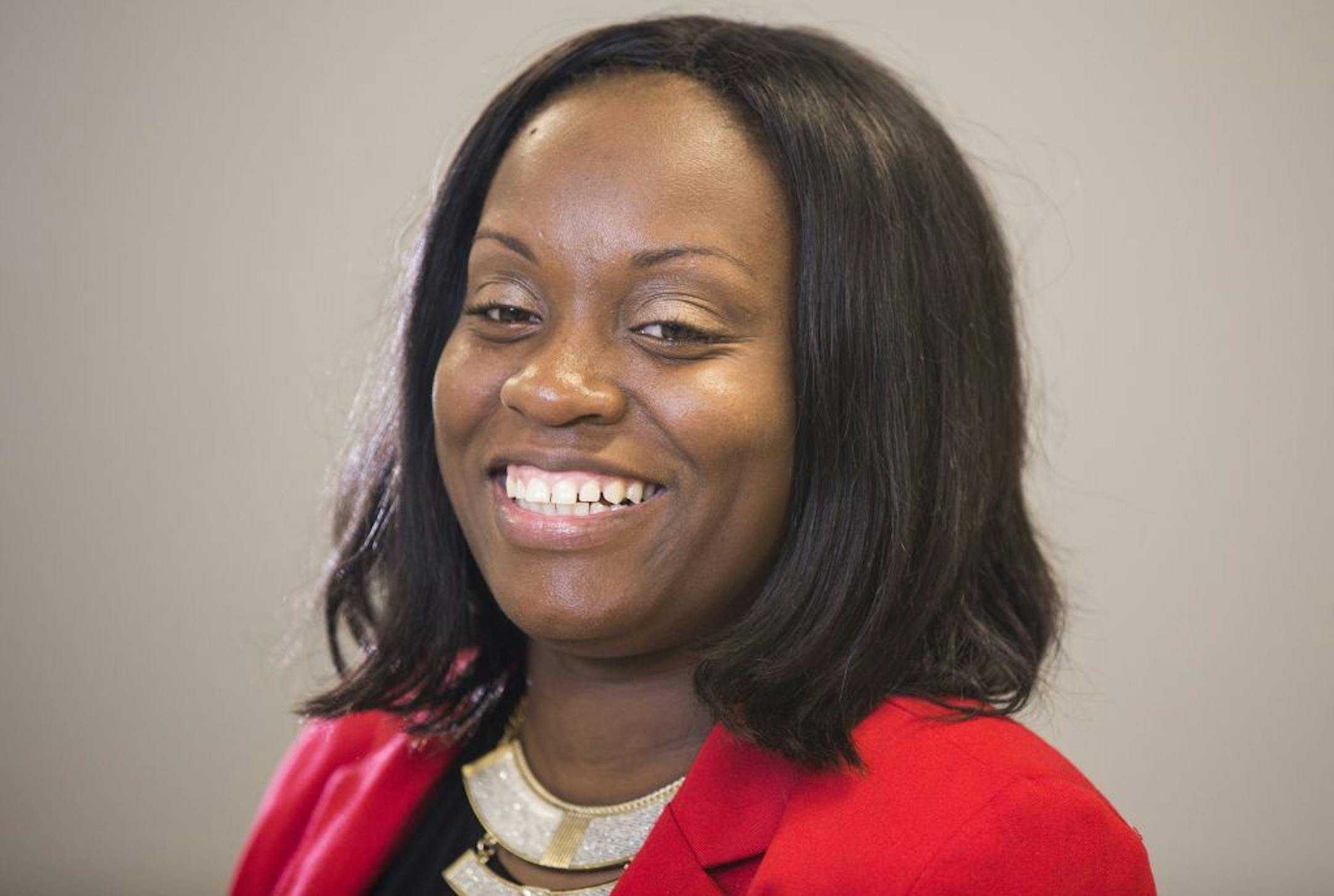 Satin Taylor Huff was mentored by philanthropist Erika Binger 15 years ago at Boys & Girls Club and is now a manager at Allina Hospitals. Photographed in the Star Tribune studio in Minneapolis on Monday, September 28, 2015.