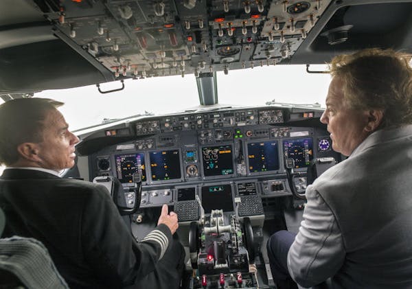 Former Sun Country owner Marty Davis, right, and Capt. Brian Roseen, then chairman of the pilots union, checked out a new Boeing 737 in 2015, after th