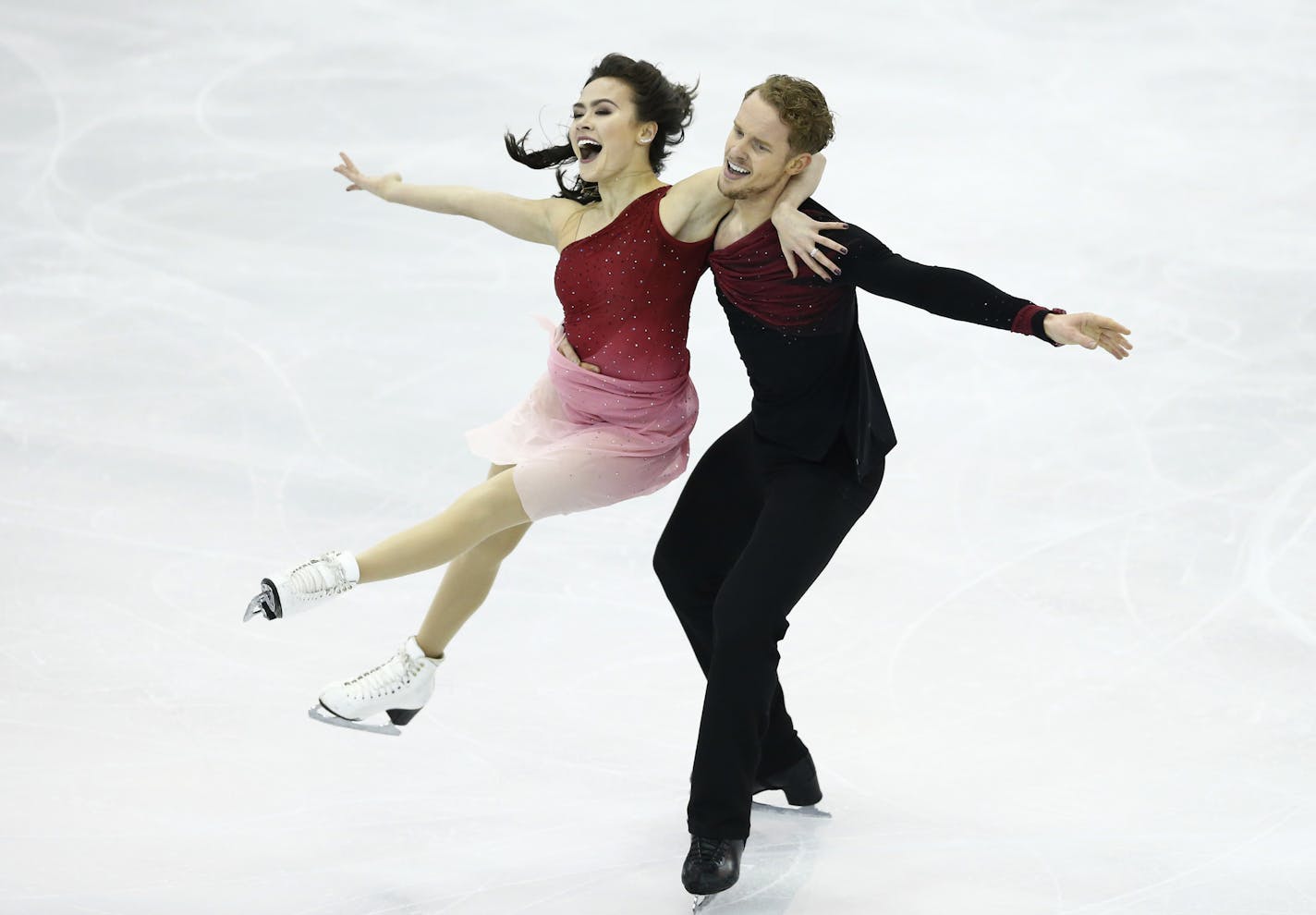 Madison Chock, left and Evan Bates of the U.S. perform during the Ice Dance final of the Grand Prix Final figure skating competition in Barcelona, Spain, Saturday, Dec. 12, 2015. (AP Photo/Manu Fernandez) ORG XMIT: MIN2016012117534045