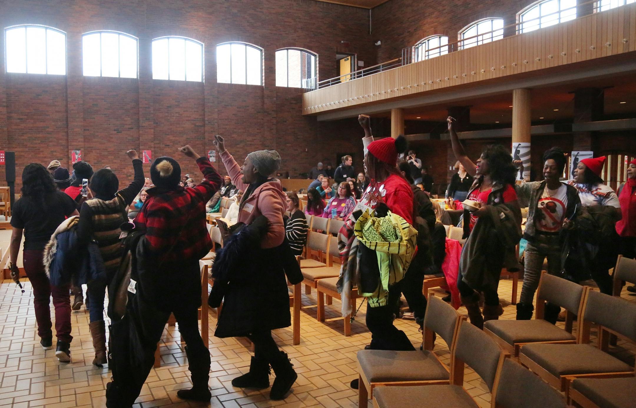 Take A Knee Nation, a two-day conference discussing Colin Kaepernick's protest against police brutality, kicked off Saturday, Feb. 3, 2018, at Augsburg University in Minneapolis, MN. Here, mostly mothers who had lost children by police shootings marched into Foss Center at Augsburg at the beginning of the conference.