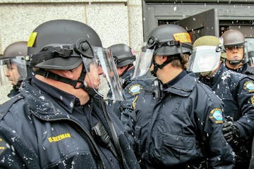 t030312 --- Clint Austin --- 121117.N.DNT.RIOTGEAR.C01 --- Duluth Police officers were riot gear during a protest by the Supreme White Alliance at Cit