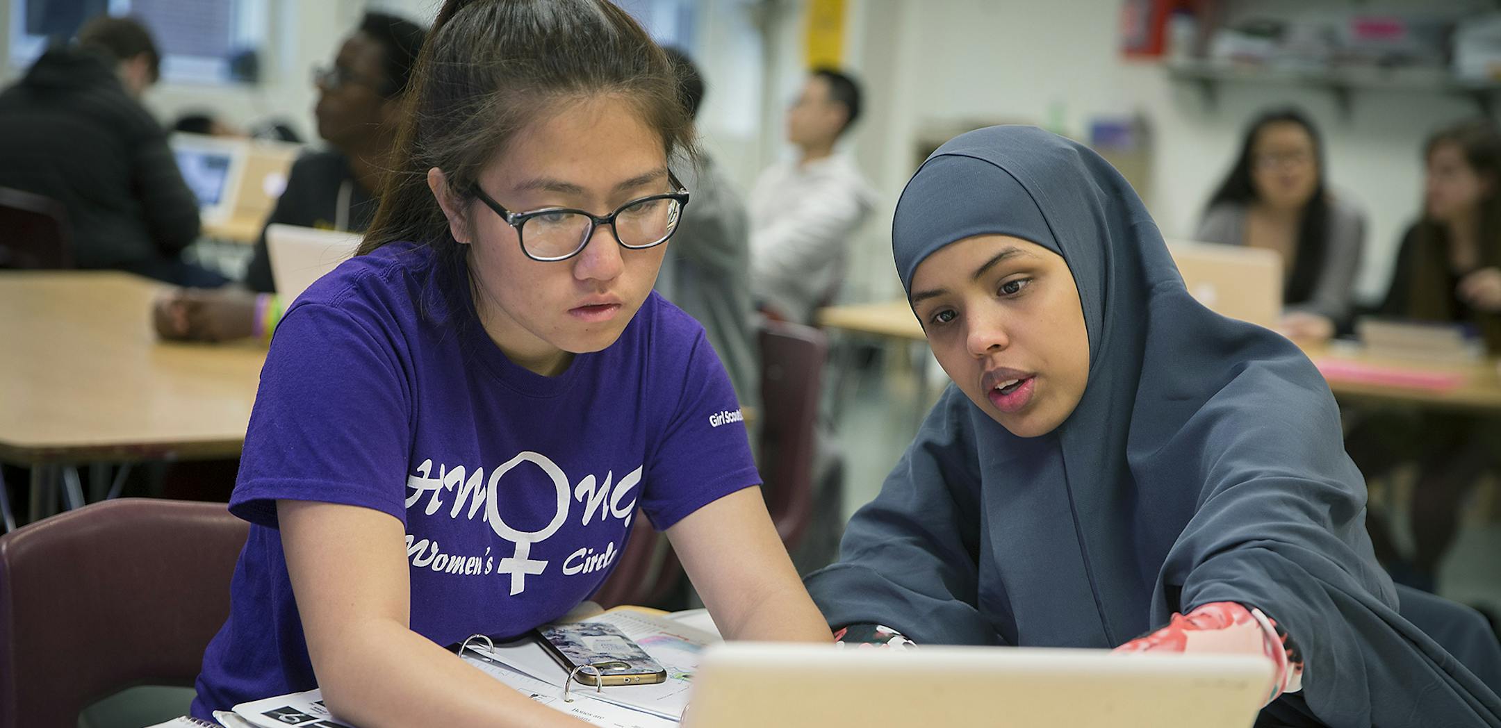 Washington Tech Magnet High School juniors Ann Lee, left, and Nabiha Ali, cq, searched for the phenological events and non-native species that they identified after a hike for an AP biology class, Thursday, June 7 2018 in St. Paul, MN. ] ELIZABETH FLORES • liz.flores@startribune.com