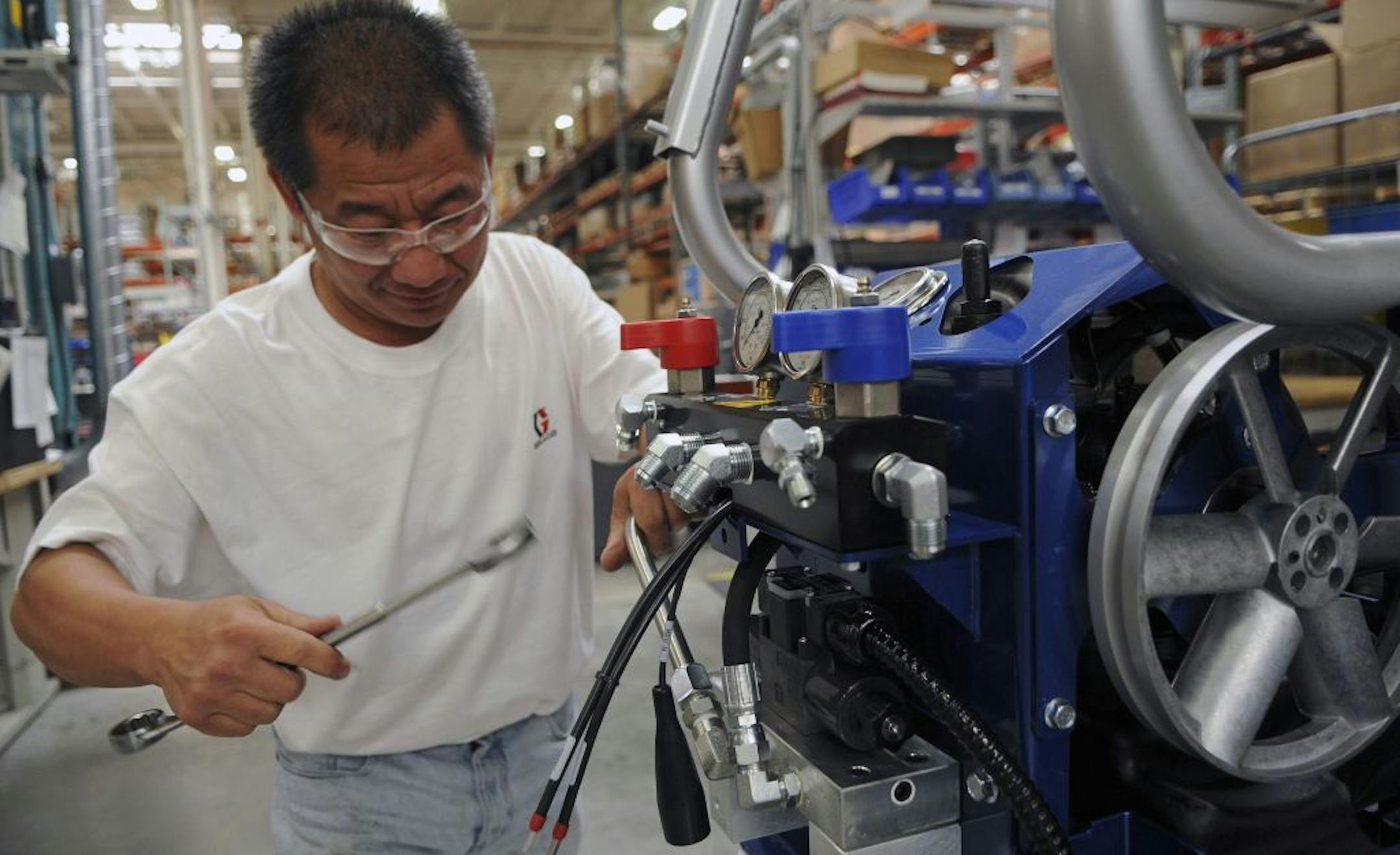 Yeng Houa Lee assembled an HXP2 Reactor at Graco Inc.'s manufacturing plant in Minneapolis. The machine is used by the insulation market to spray expanding foam.