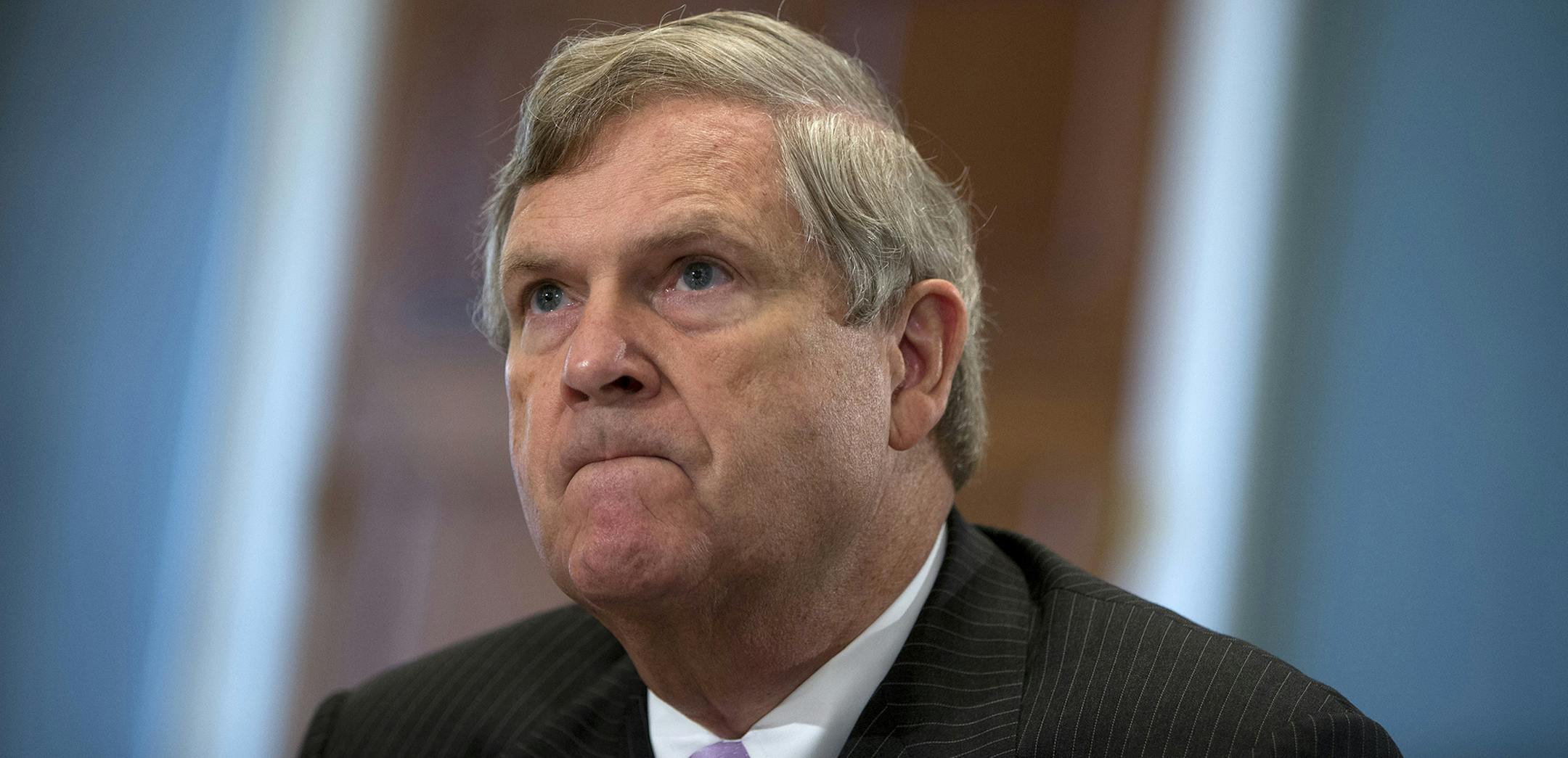 FILE - In this Oct. 7, 2015 file photo, Agriculture Secretary Tom Vilsack, pauses as he testifies on Capitol Hill in Washington before the House Agriculture Committee hearing on the 2015 Dietary Guidelines for Americans. The Agriculture Department is announcing Monday, Feb. 29, 2016, that it will require states to transition from paper vouchers to electronic cards over the next five years. WIC will now use the same type of Electronic Benefits Transfer, or EBT, cards used by food stamp recipients