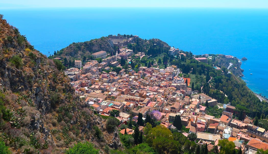Taormina, Sicily, with its ancient Greek theater in the background.  