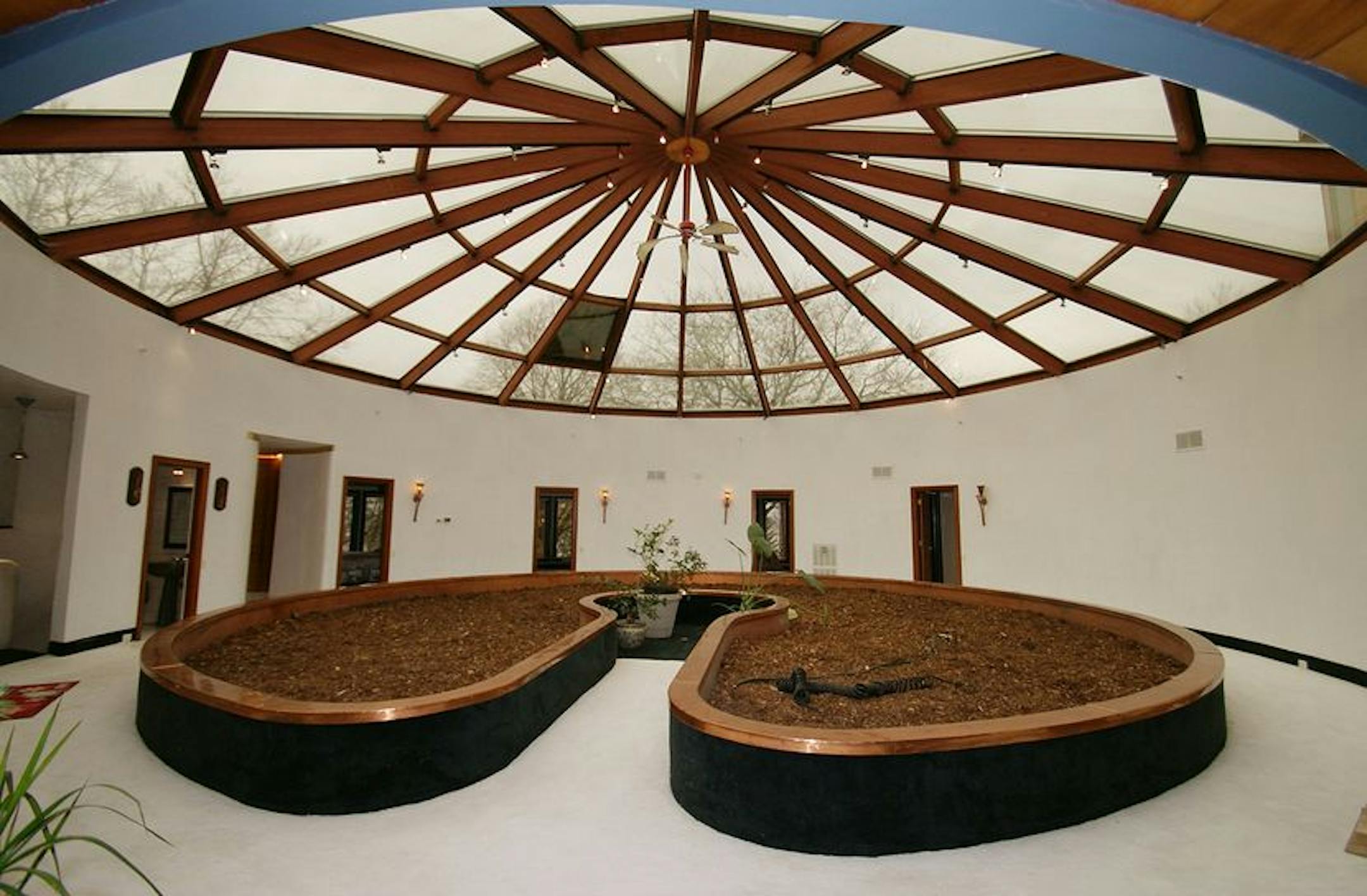 The home features an indoor garden under a skylight.