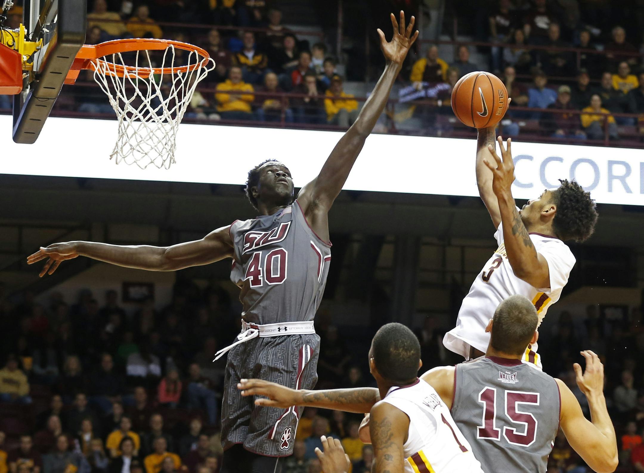 Minnesota's Jordan Murphy, right, beats Southern Illinois' Thik Bol to a rebound during the first half of an NCAA college basketball game Friday, Nov. 25, 2016, in Minneapolis. (AP Photo/Jim Mone)