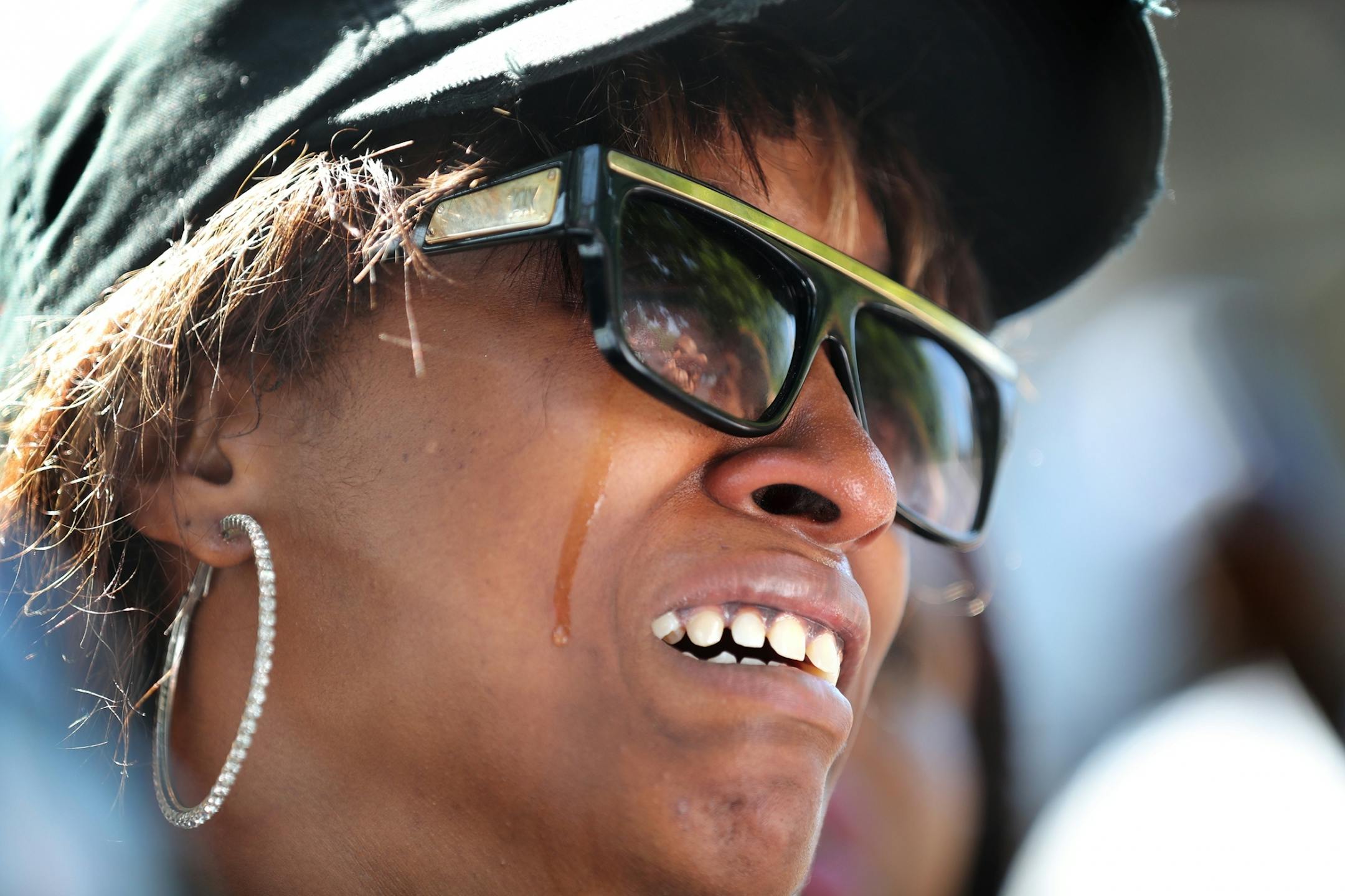 Diamond Reynolds, the girlfriend of Philando Castile, breaks down in tears during a press conference outside the governor's residence in St. Paul.