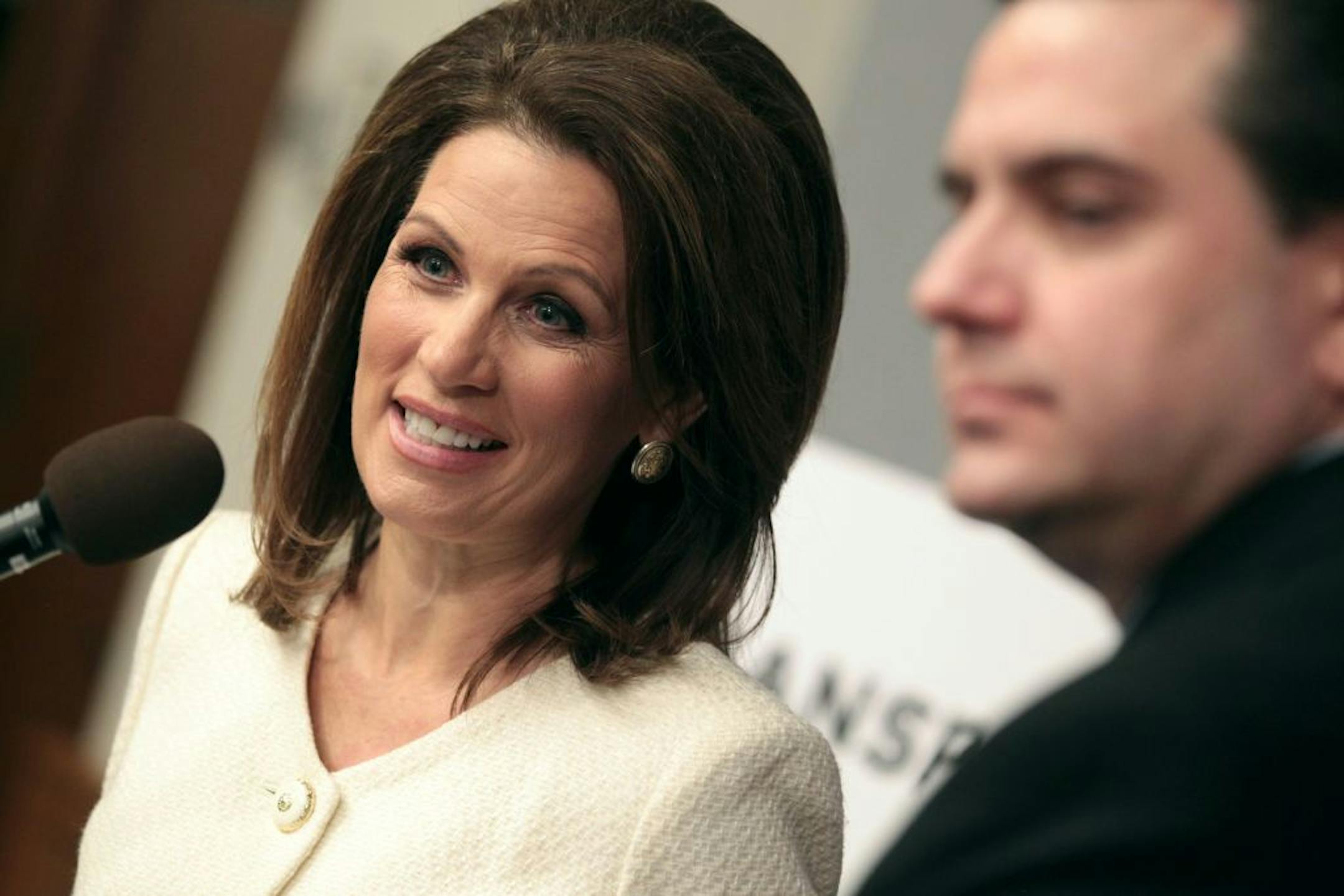 U.S. Representative Michele Bachmann and senator Sean Nienow, (R) of Cambridge read statements regarding allegations of fraud in Minnesota Medicaid programs at capitol Monday February 20, 2012 in St. Paul, Minnesota .