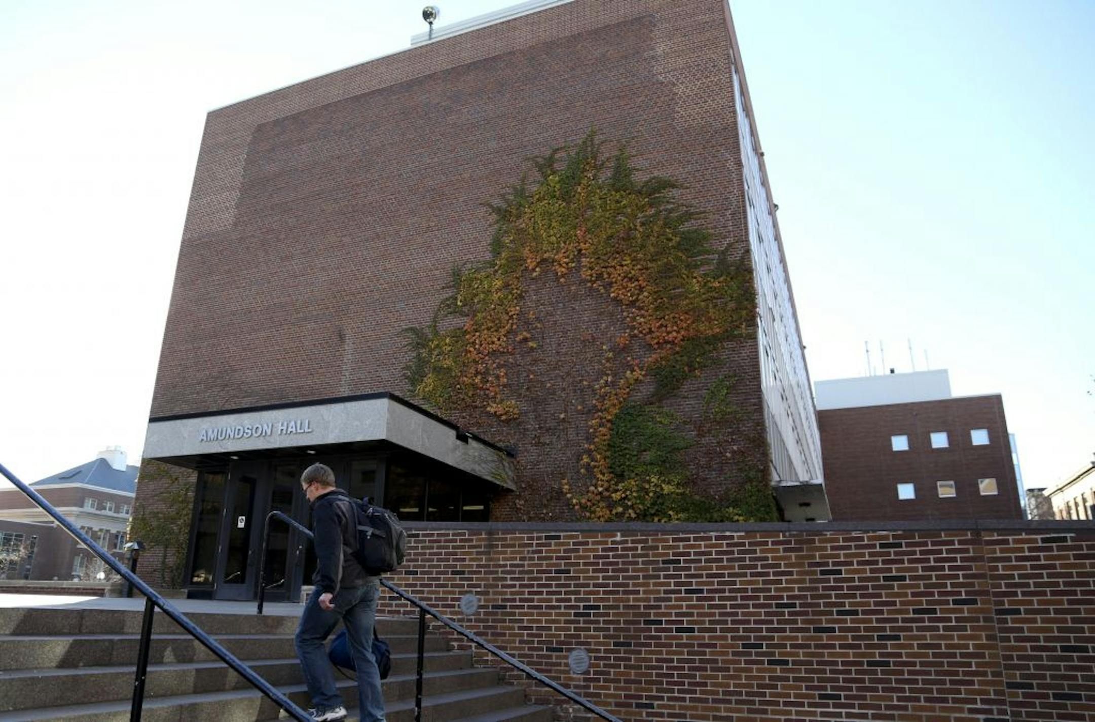 A pedestrian walked up the stairs in front of Amundson Hall at the University of Minnesota in Minneapolis, Min., Wednesday October 31, 2012. Bob Gore inventor of Gore-Tex gave $10 million for expansion of the hall that houses the chemical engineering program