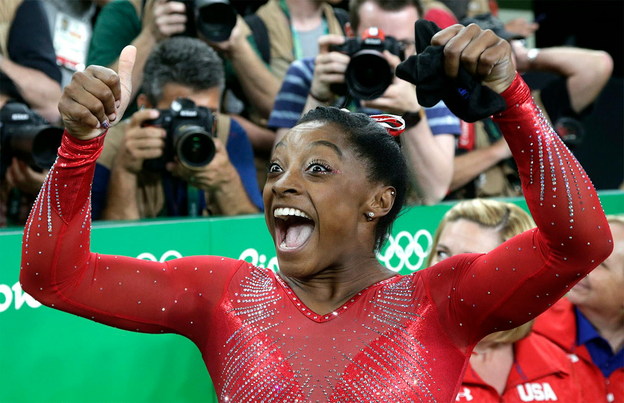United States' Simone Biles celebrates after her winning gold in the vault during the artistic gymnastics women's apparatus final at the 2016 Summer Olympics in Rio de Janeiro, Brazil, Sunday, Aug. 14, 2016.