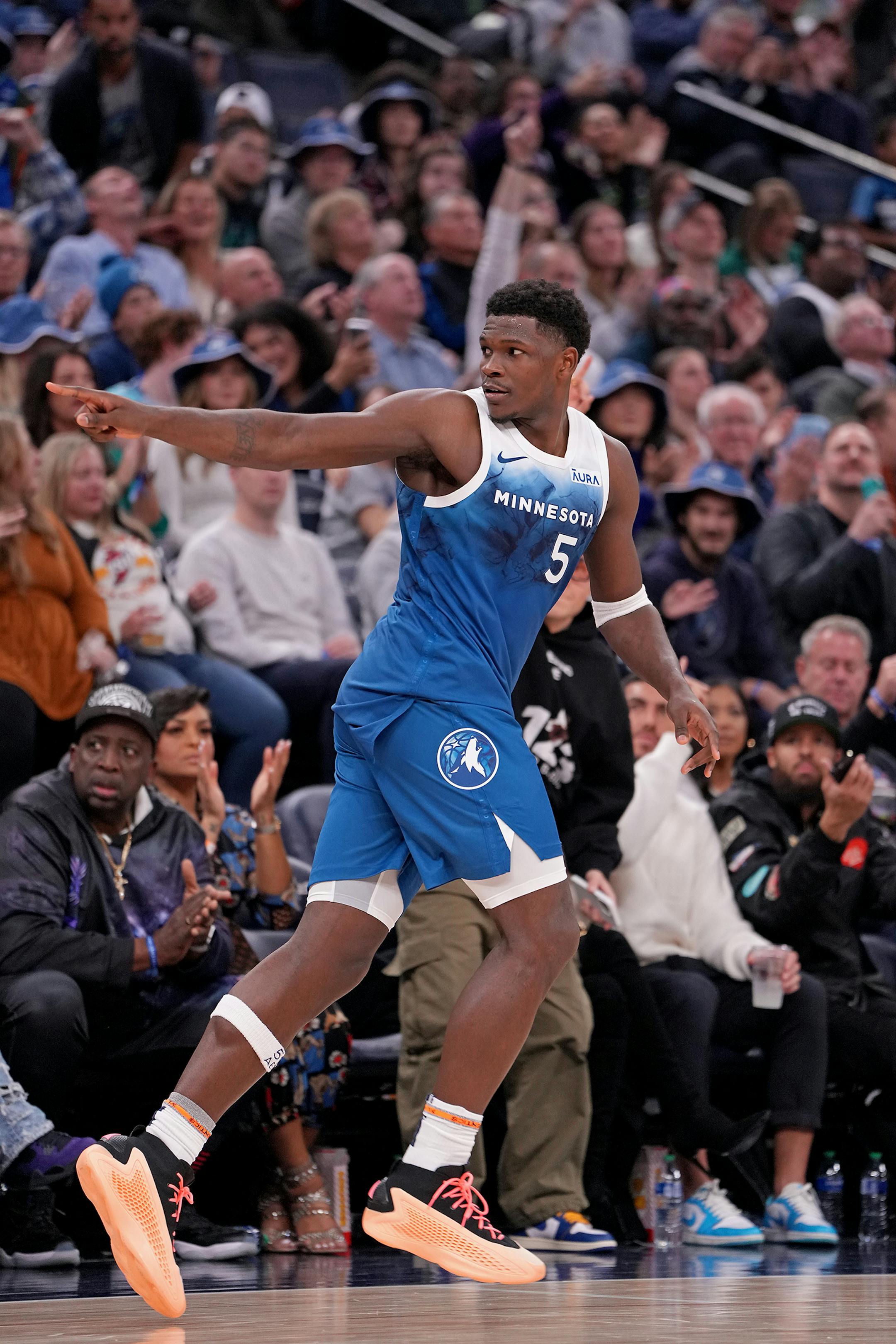 Minnesota Timberwolves guard Anthony Edwards (5) celebrates a three-pointer during the second half of the game.