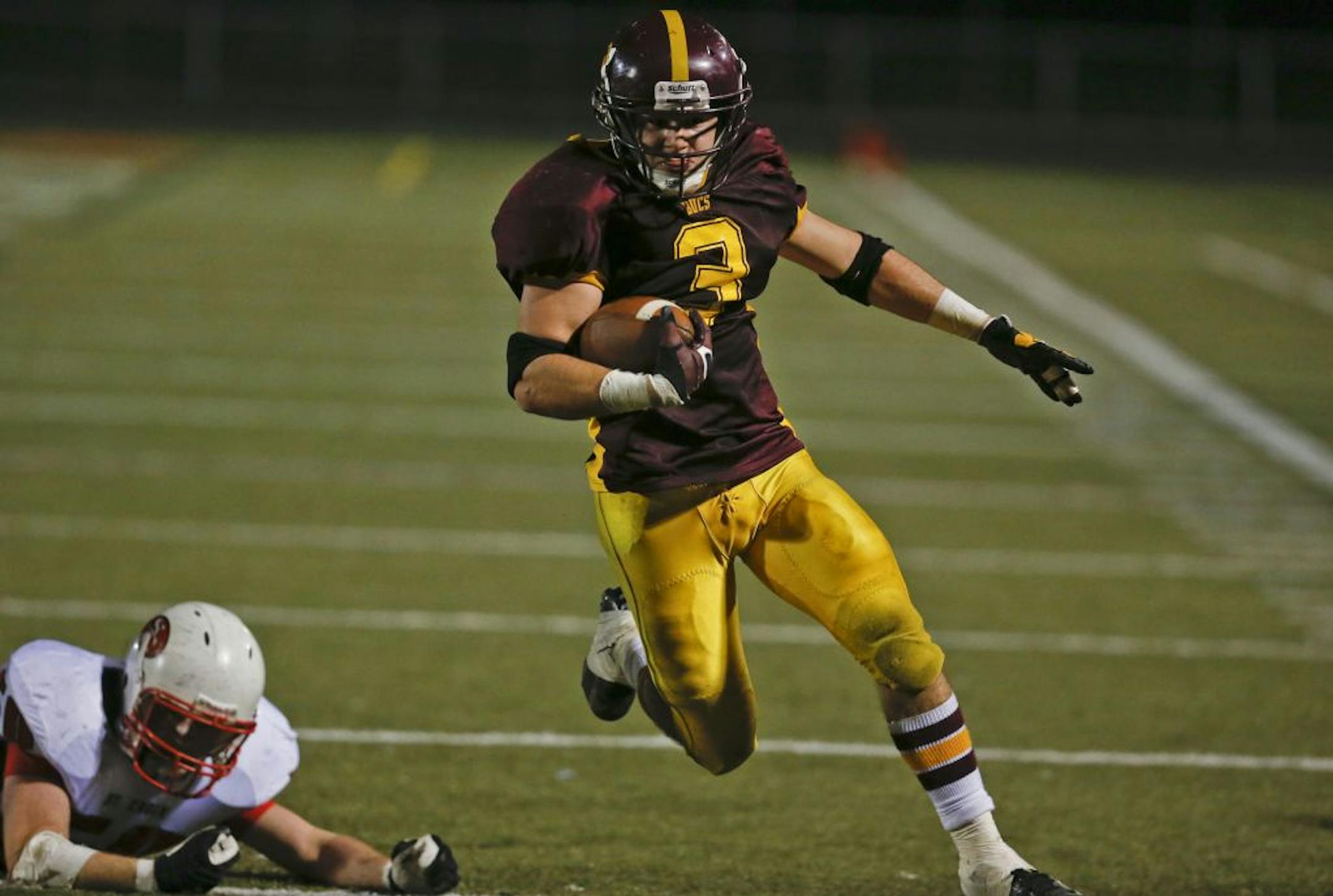 Blue Earth running back Carter Hanson leaves a St. Croix Lutheran defender behind en route to a fourth quarter TD