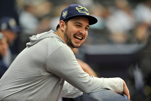 Jake Faria watches from the dugout during a Rays game against the Astros in 2018.