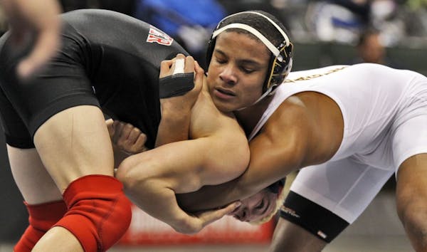 Branden Madsen of Stillwater, left, wrestled Mark Hall of Apple Valley in the Class 3A 145-lb match. Hall won.
