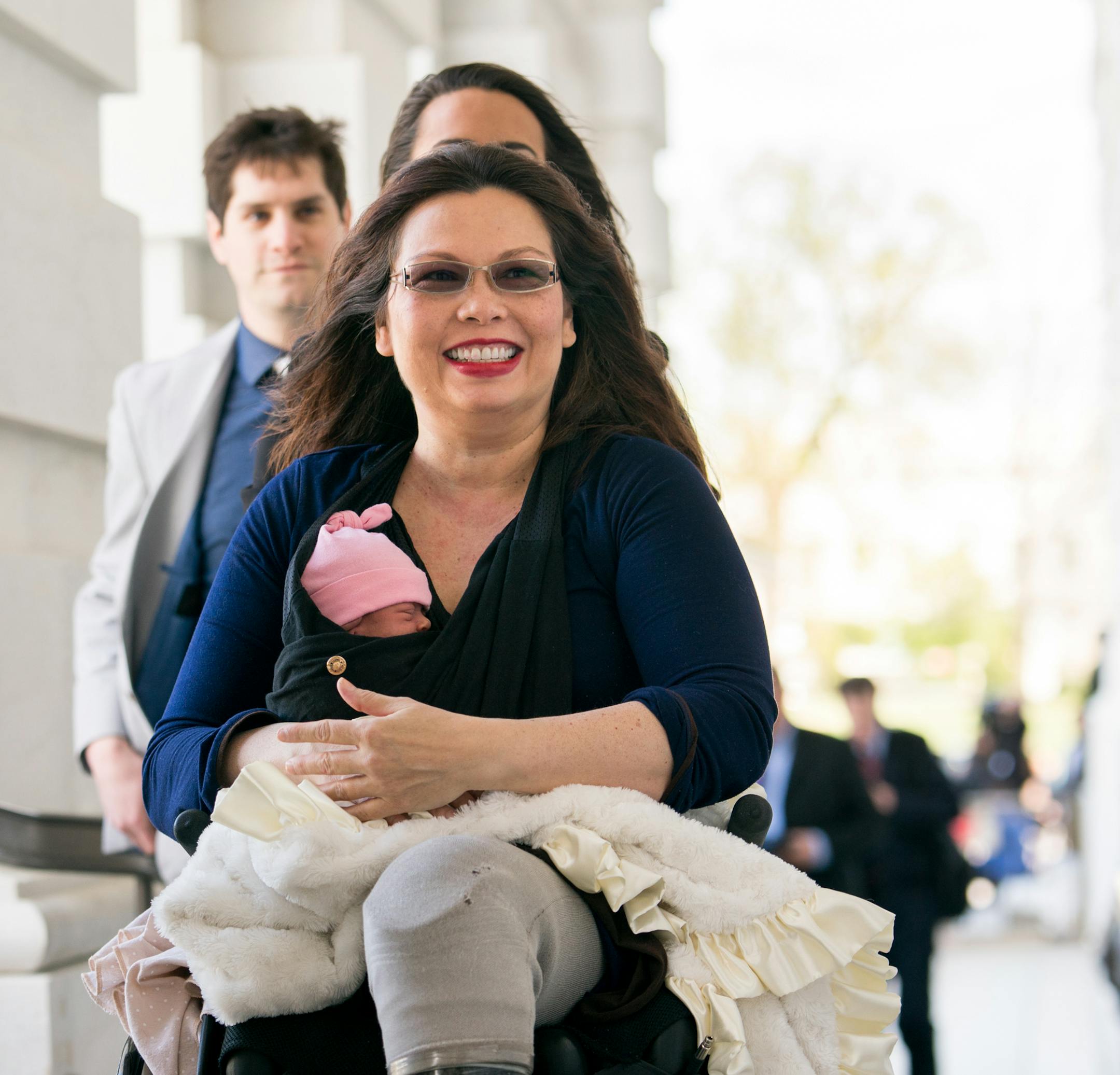 FILE -- Sen. Tammy Duckworth (D-Ill.) arrives at the Capitol with her 10-day-old daughter, Maile, for a vote in Washington, April 19, 2018. Duckworth's colleague, Sen. Susan Collins (R-Maine), said a Supreme Court pick who would overturn the abortion rights case ìwould not be acceptable to me.î (Erin Schaff/The New York Times)