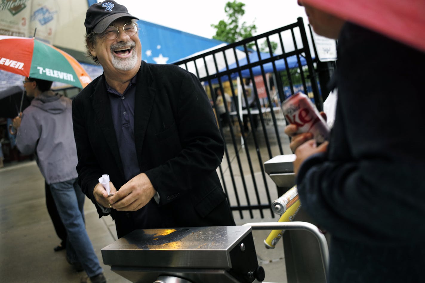 At Midway Stadium, Saints owner Mike Veeck loves interacting with the fans including taking tickets at the gate and joking with them. ] rtsong-taatarii@startribune.com