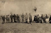 The families of Chiefs Mickinock and Cobenais posed in 1887 at their main village on Roseau Lake, which was drained for farming in the early 1900s. Mi
