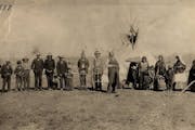 The families of Chiefs Mickinock and Cobenais posed in 1887 at their main village on Roseau Lake, which was drained for farming in the early 1900s. Mi