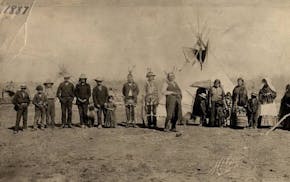 The families of Chiefs Mickinock and Cobenais posed in 1887 at their main village on Roseau Lake, which was drained for farming in the early 1900s. Mi