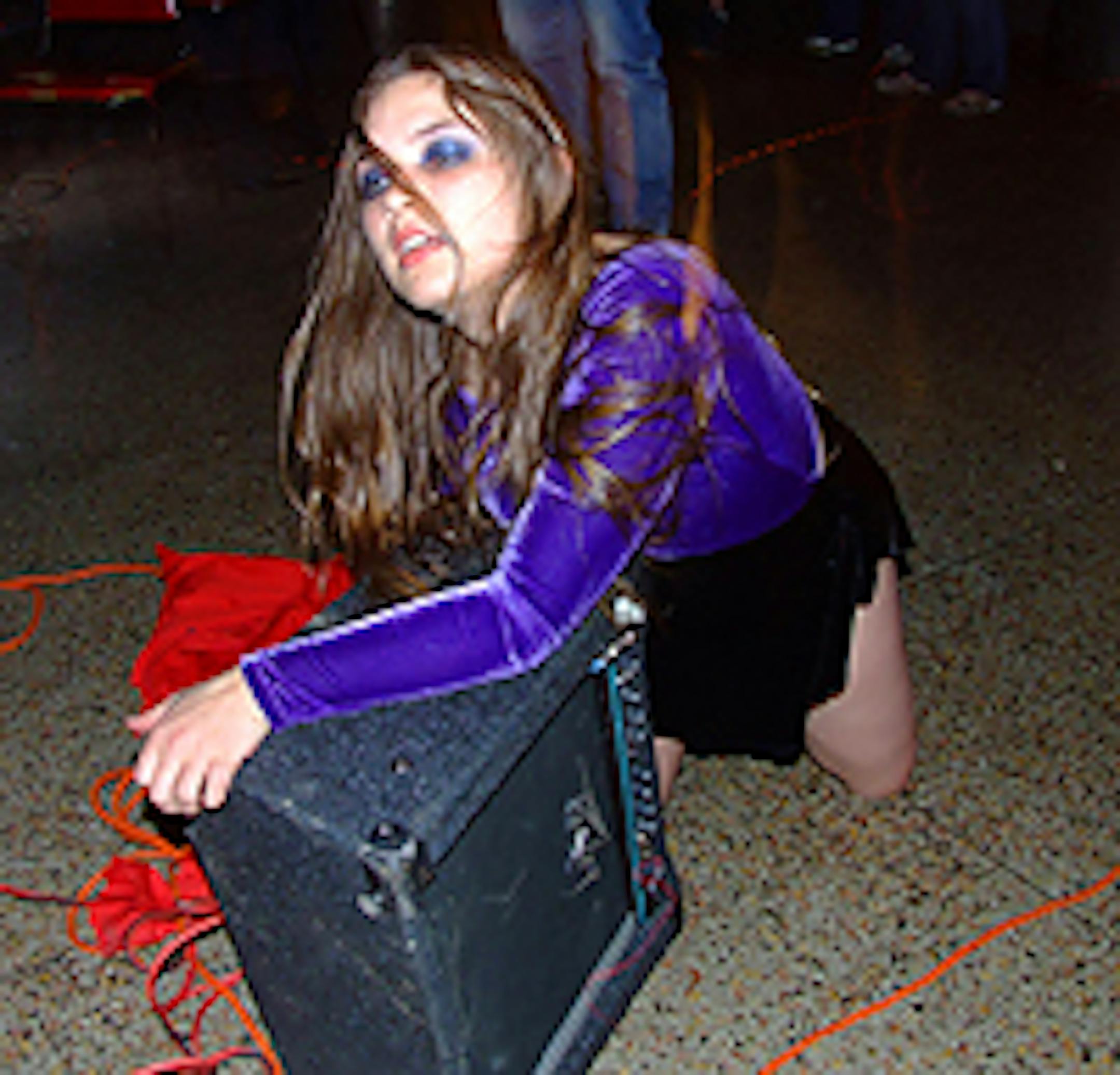 A member of noise band Laundry Room Squelchers gets into a performance.