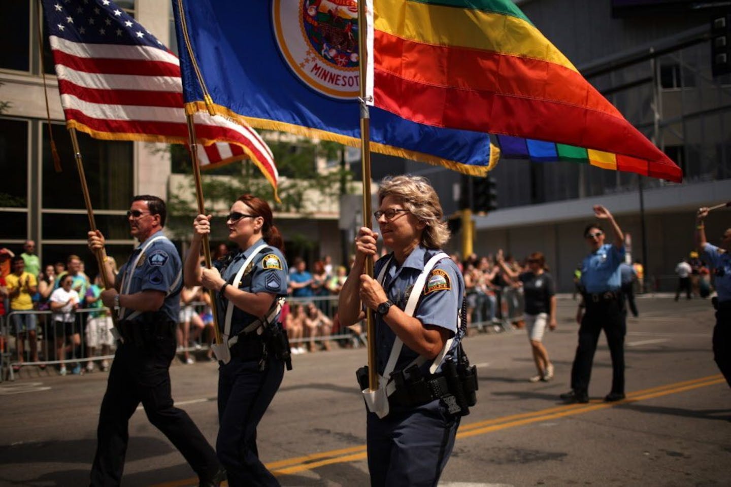 Officers from Minneapolis and St. Paul police departments led the 2015 Pride parade down Hennepin Ave.