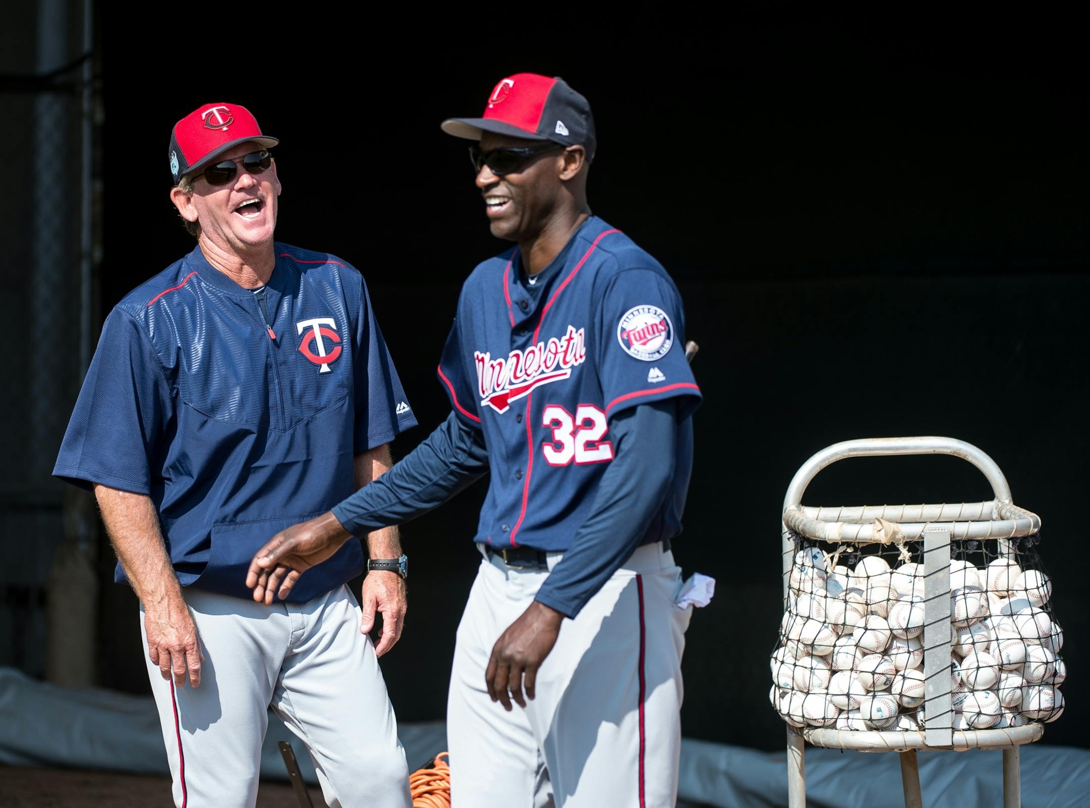Twins pitching coach Neil Allen, left, laughed with special instructor LaTroy Hawkins Saturday in the bullpen.