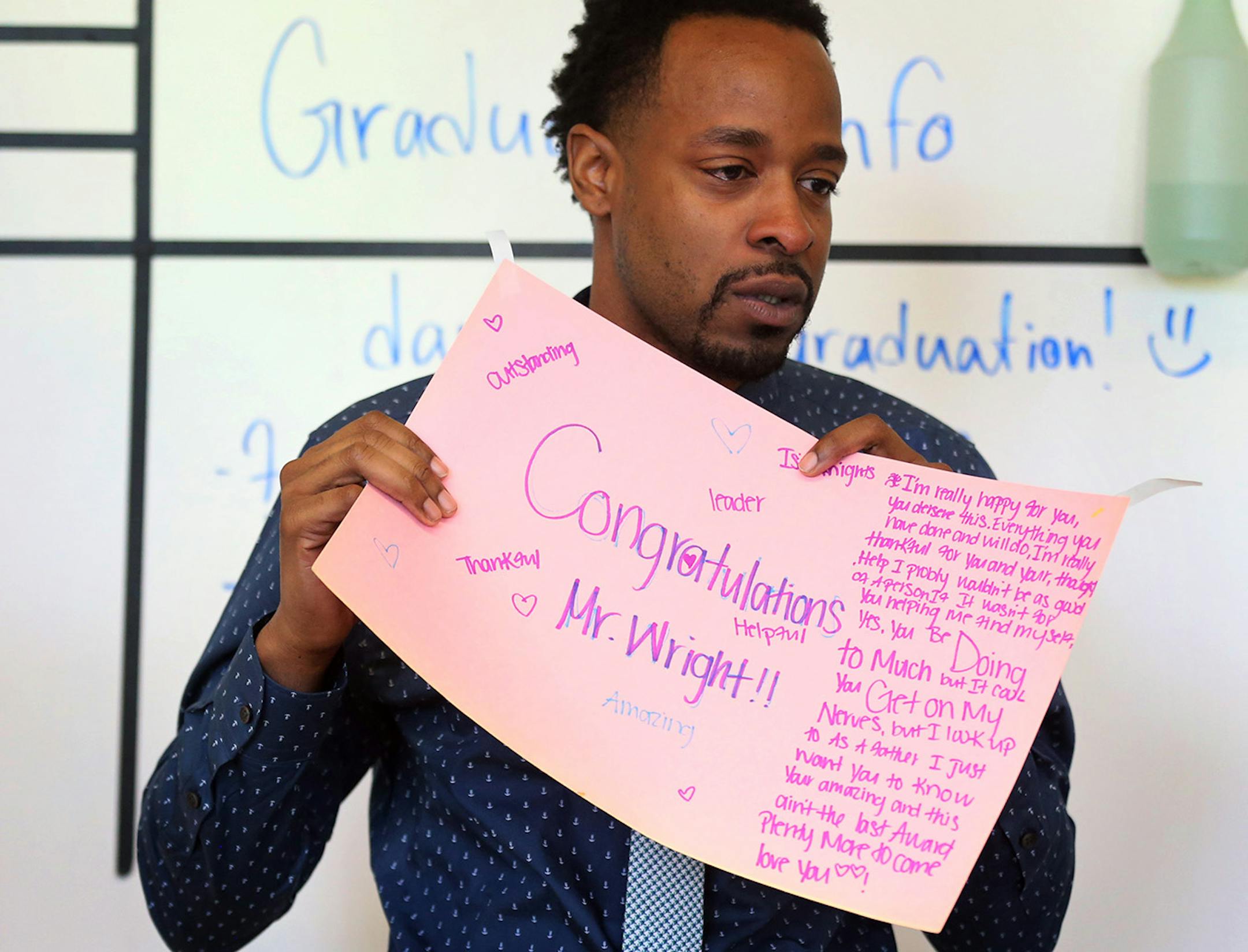 An emotional Abdul Wright wiped tears from his eyes after reading a congratulations letter from his students at Best Academy on Monday after he had won the 2016 Minnesota Teacher of the Year award.