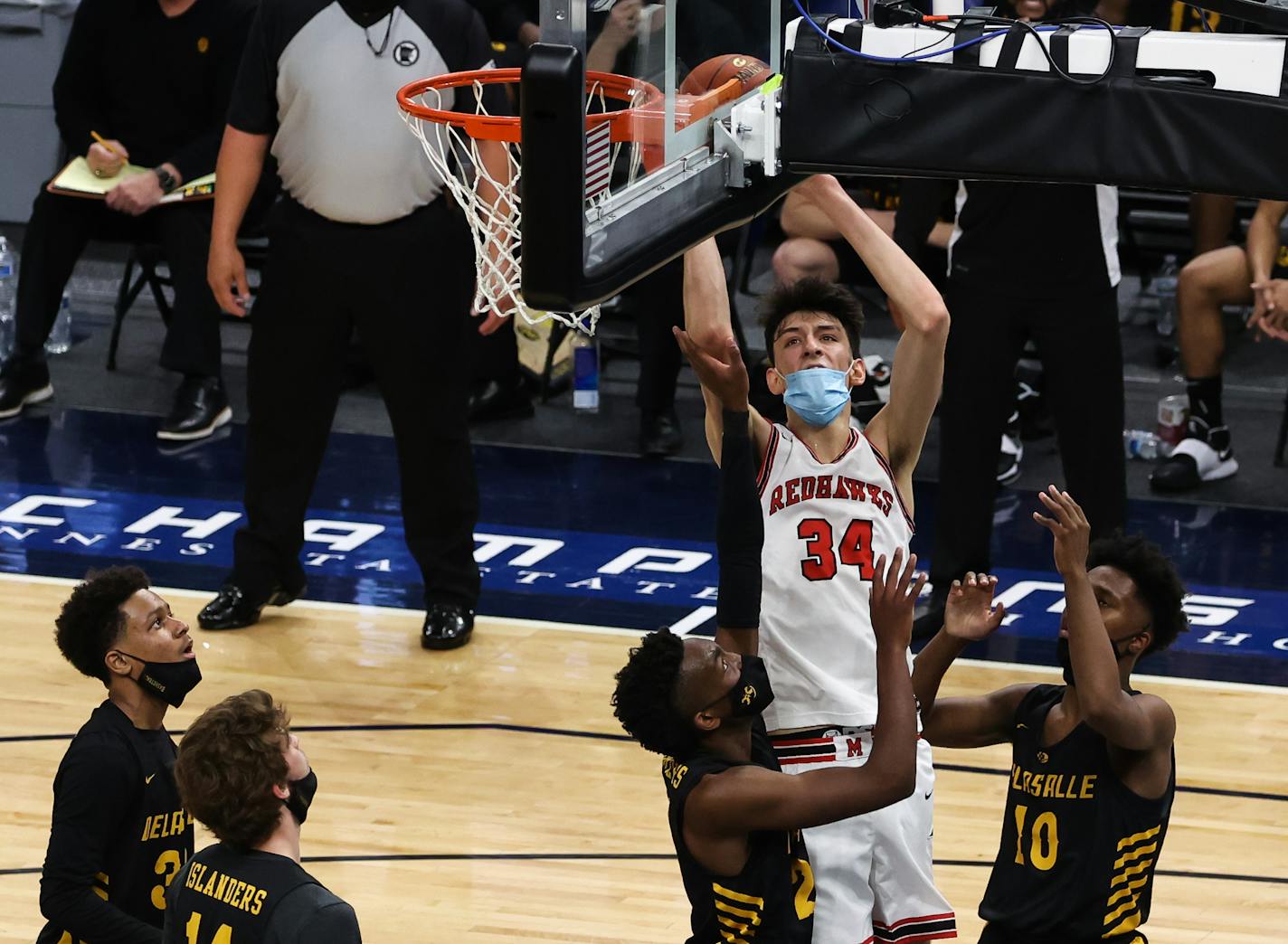 Minnehaha Academy's Chet Holmgren (34) scored from the low post over the heads of four DeLaSalle defenders in the first half Thursday of the Class 3A semifinal at Target Center. Photo: Cheryl A. Myers, SportsEngine