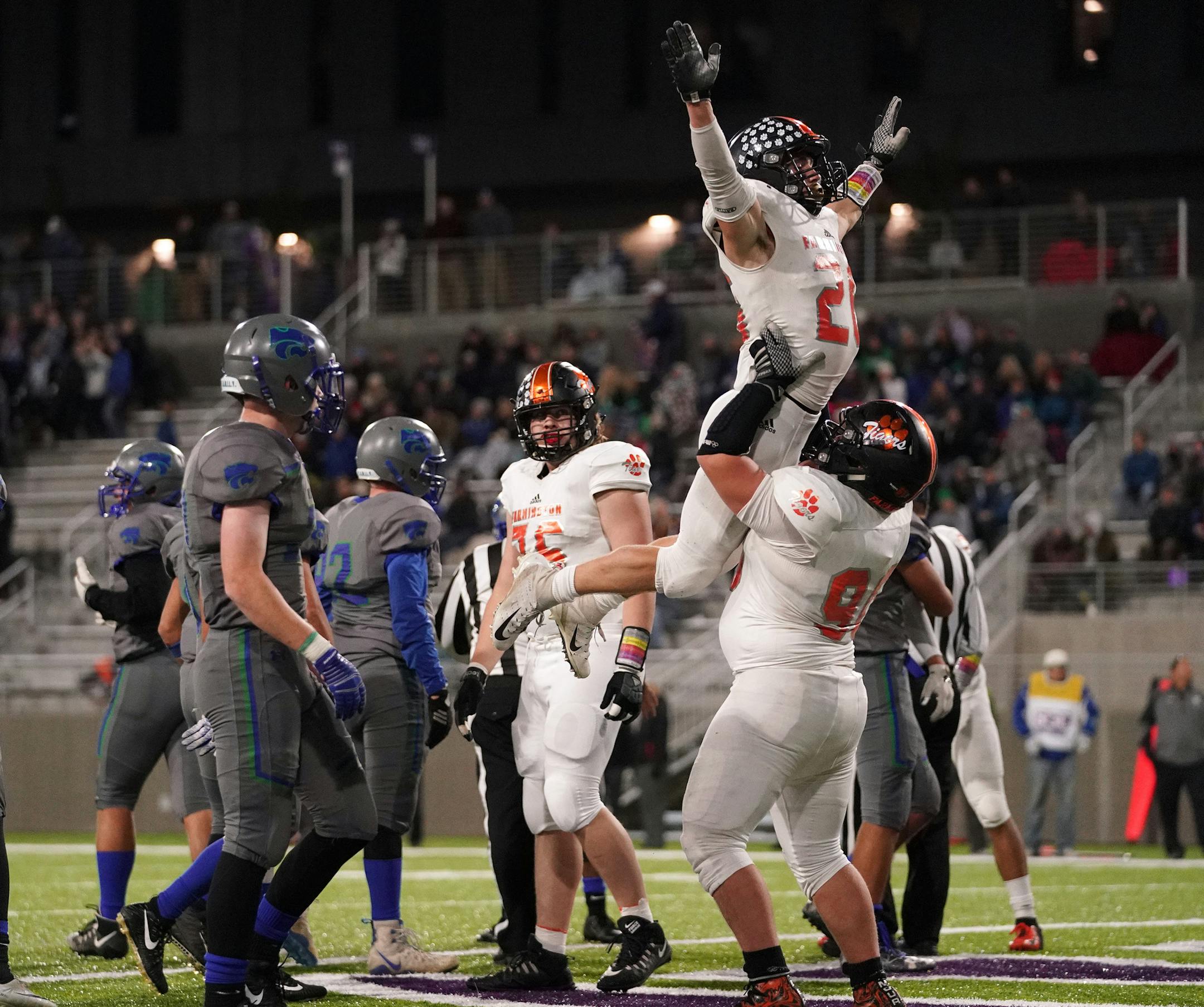Farmington High School running back Zac Janz (26) was hoisted up in celebration by his teammate after he scored a touchdown in the second half. ] ANTHONY SOUFFLE ï anthony.souffle@startribune.com Eagan High School played Farmington High School in an MSHSL football game Friday, Sept. 28, 2018 at TCO Stadium, the Viking's practice facility, in Eagan, Minn.