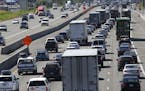 In this Wednesday, Aug. 24, 2016, photo, truck and automobile traffic mix on Interstate 5, headed north through Fife, Wash., near the Port of Tacoma. 