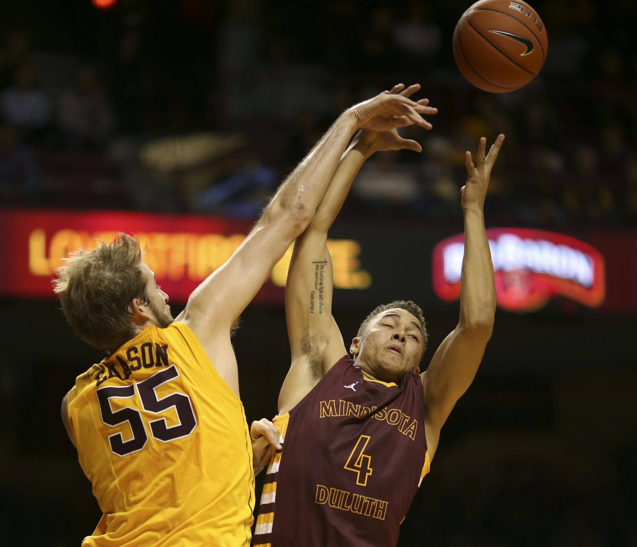 Minnesota's Elliott Eliason knocked a rebound away from UMD's Justin Byrd in the second half Thursday night at Williams Arena. ] JEFF WHEELER ‚Ä¢ jeff.wheeler@startribune.com The University of Minnesota men's basketball team beat the University of Minnesota Duluth 95-68 in their first exhibition game of the season Thursday night, November 6, 2014 at Williams Arena on the Minneapolis campus.