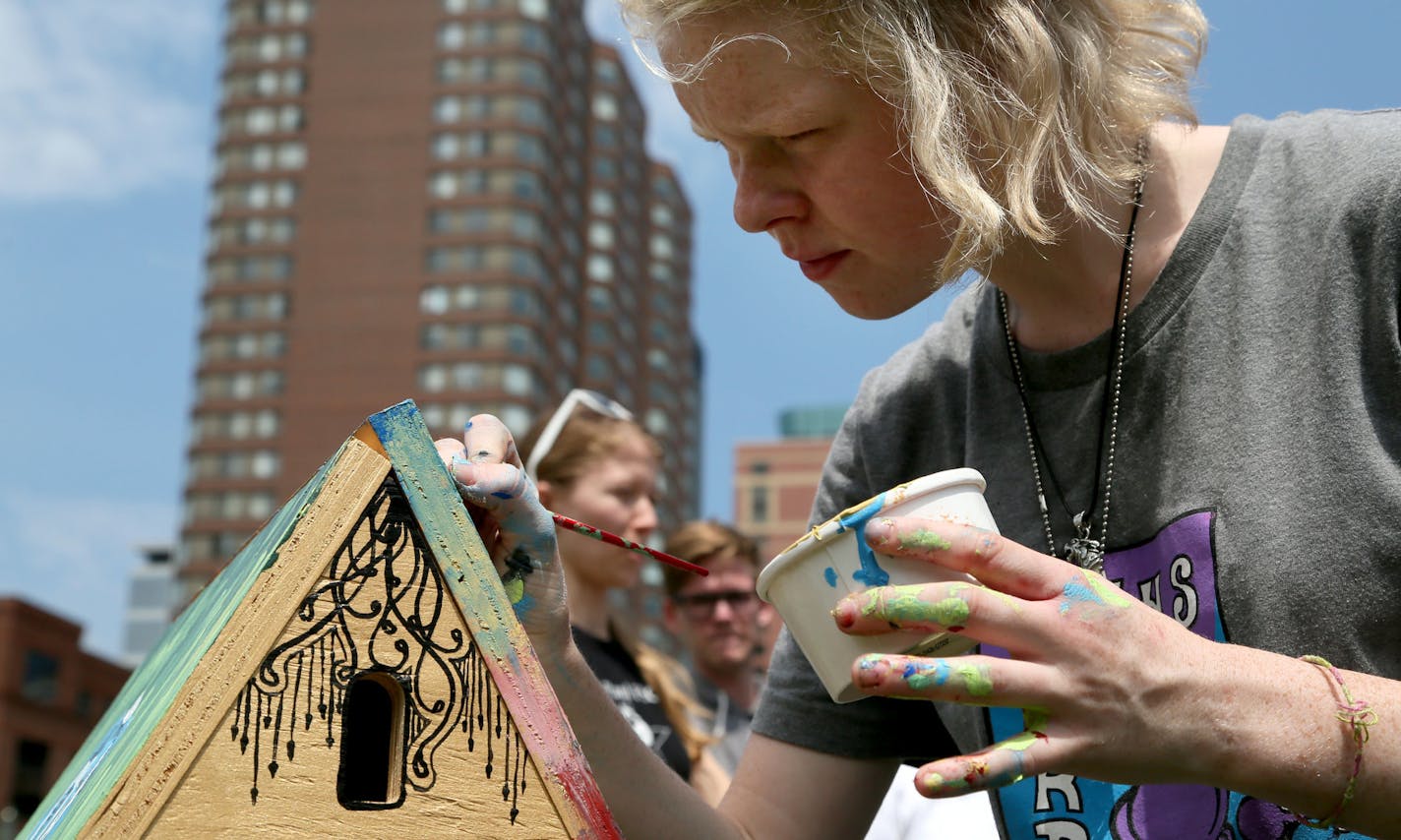 Mini_Polis is a miniature model of Minneapolis, built in collaboration with many people who live here and in Minnesota or have connections to Minneapolis. Here, Anna Reynolds, of Milwaukee, whose brother Jon Reynolds was among the projects organizers, works on a house with her sister, Natalie, not pictured. The model city is on display at the Minneapolis Convention Center Plaza and was seen Saturday, June 6, 2015, in Minneapolis, MN.]](DAVID JOLES/STARTRIBUNE)djoles@startribune.com Niko Kubota,