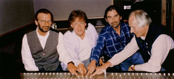 The BEATLES WITH GEORGE MARTIN--Ringo Starr, Paul McCartney, George Harrison with George Martin in Abbey Road Studios, summer 1995. MANDATORY CREDIT: 