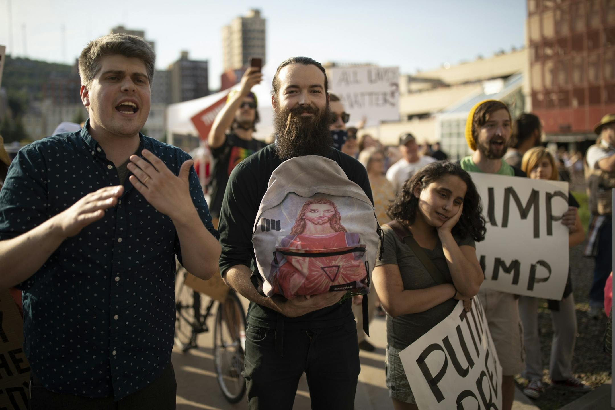 Anti-trump demonstrators argued with Trump supporters outside Amsoil Arena during the President's appearance Wednesday evening.