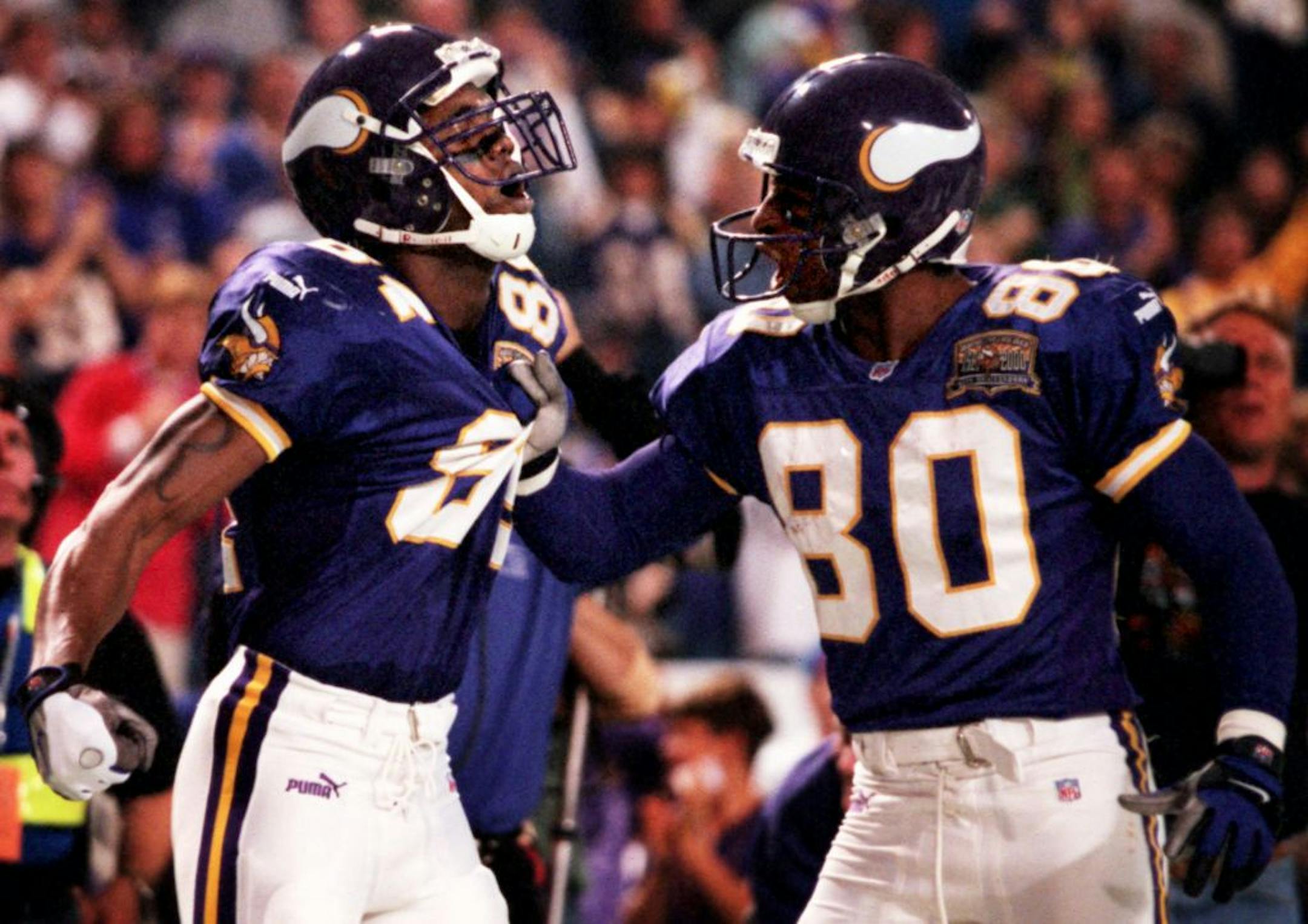 Randy Moss, left, and Cris Carter formed a dynamic duo with the Vikings, but both had pointed words for the other on Tuesday.