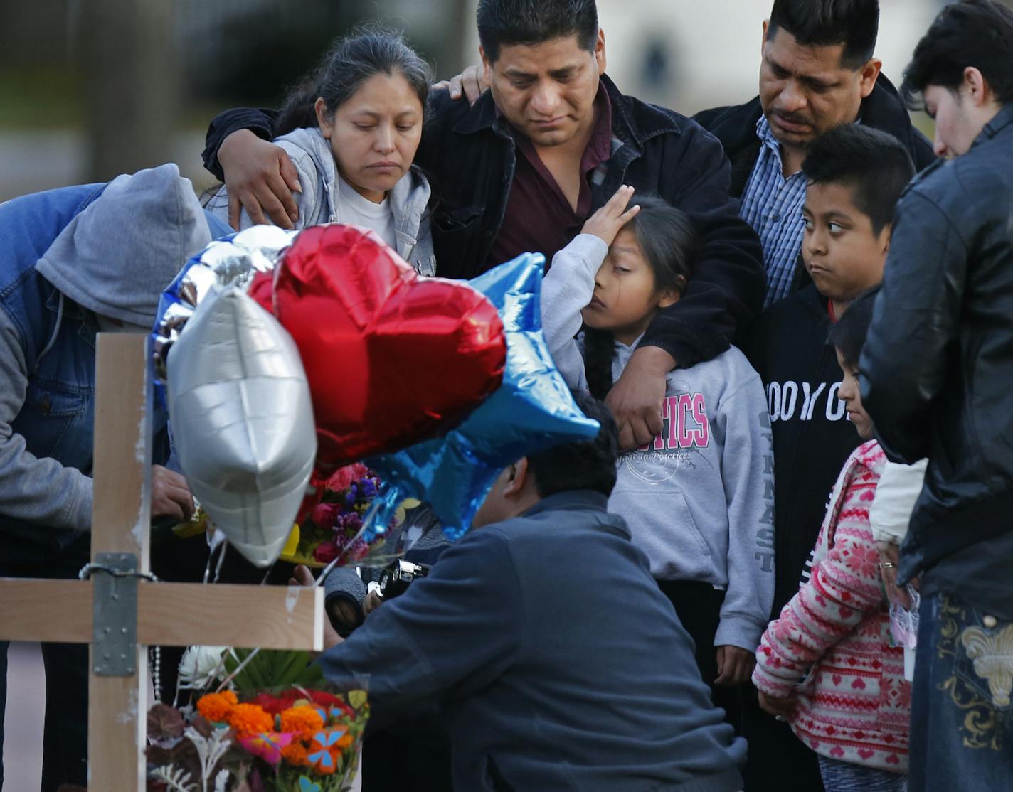 Near the intersection of Knox Ave. and Memorial Parkway, family members mourned the loss of a five-year old boy who was killed while trick or treating last night.]Richard Tsong-Taatarii/rtsong-taatarii@startribune.com