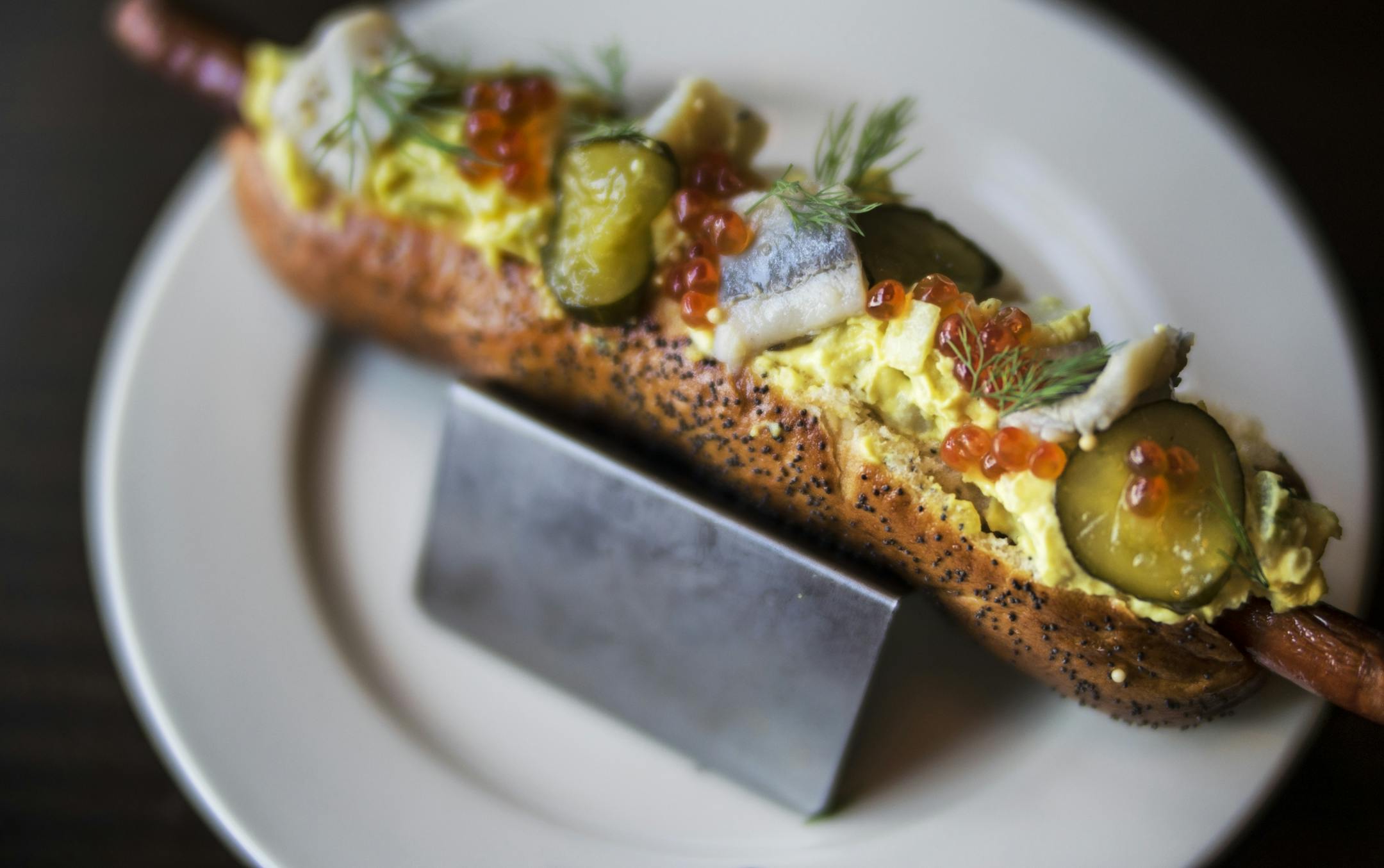 The Minnesoter is a foot-long Kramarczuk dog with potato salad, pickled herring, fermented cucumber, and salmon roe.