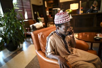 Abu Bakr, now a resident at the hotel, made a call in the lobby Wednesday afternoon. He was living in his car before last week's unrest, but his car w