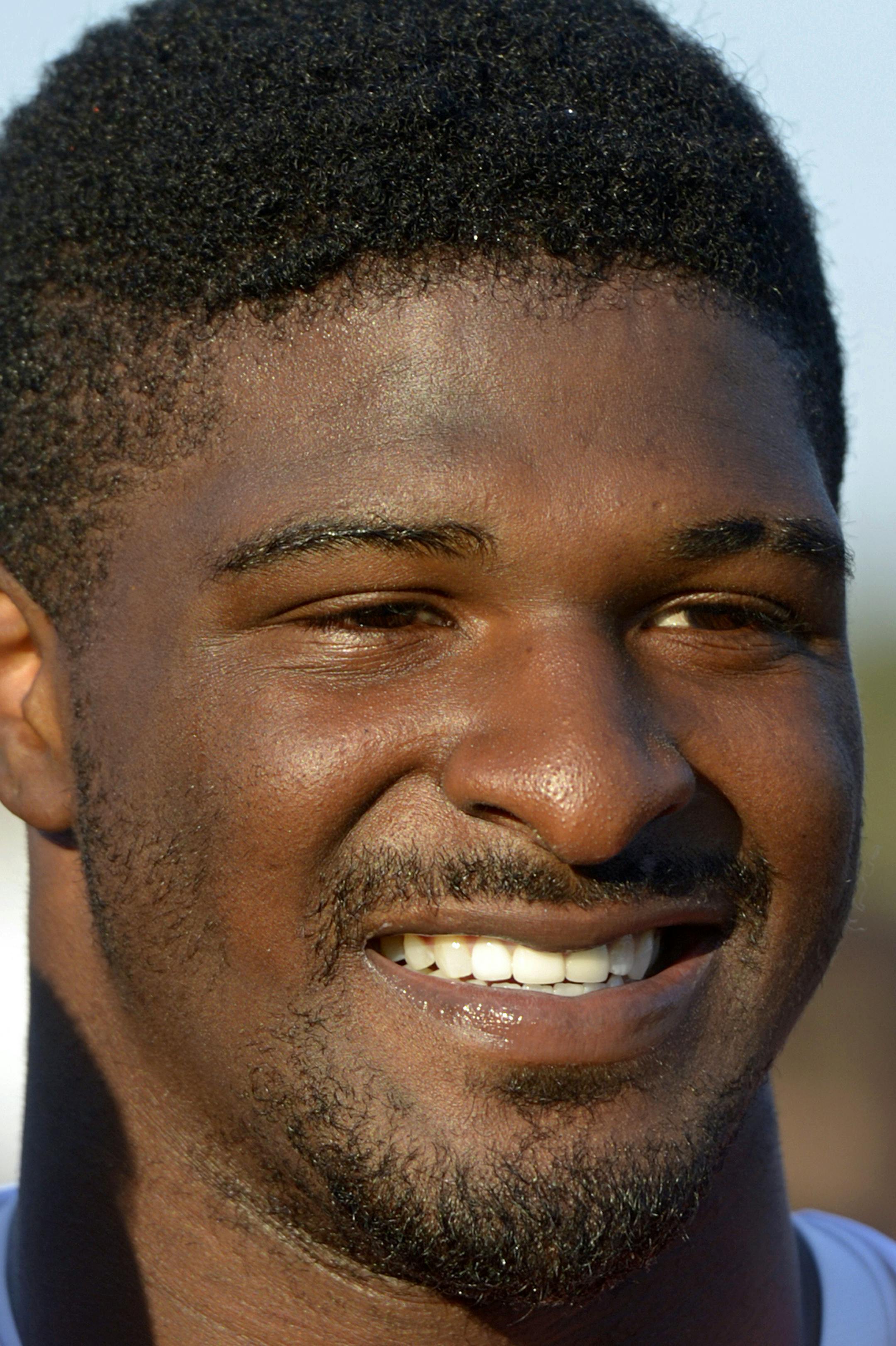 South Squad defensive end Dee Ford of Auburn (30) smiles as he poses for photos with fans following Senior Bowl practice at Ladd-Peebles Stadium, Thursday, Jan. 23, 2014, in Mobile, Ala. (AP Photo/G.M. Andrews) ORG XMIT: NYEOTK