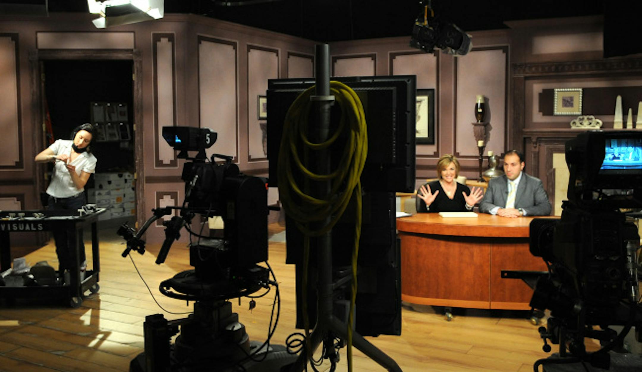 ShopNBC host Melissa Miner talked with guest jeweler Phillip Maroof about his products as visual product coordinator Cathy Christensen, left, prepared the next items for sale on ShopNBC. The Eden Prairie company named industry veteran Rene Aiu as its new CEO on Monday afternoon.