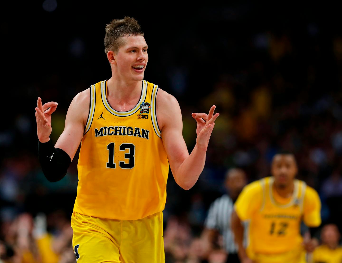 Michigan's Moritz Wagner (13) reacts after scoring a 3-point shot against Loyola-Chicago during the second half in the semifinals of the Final Four NCAA college basketball tournament, Saturday, March 31, 2018, in San Antonio. (AP Photo/Charlie Neibergall)