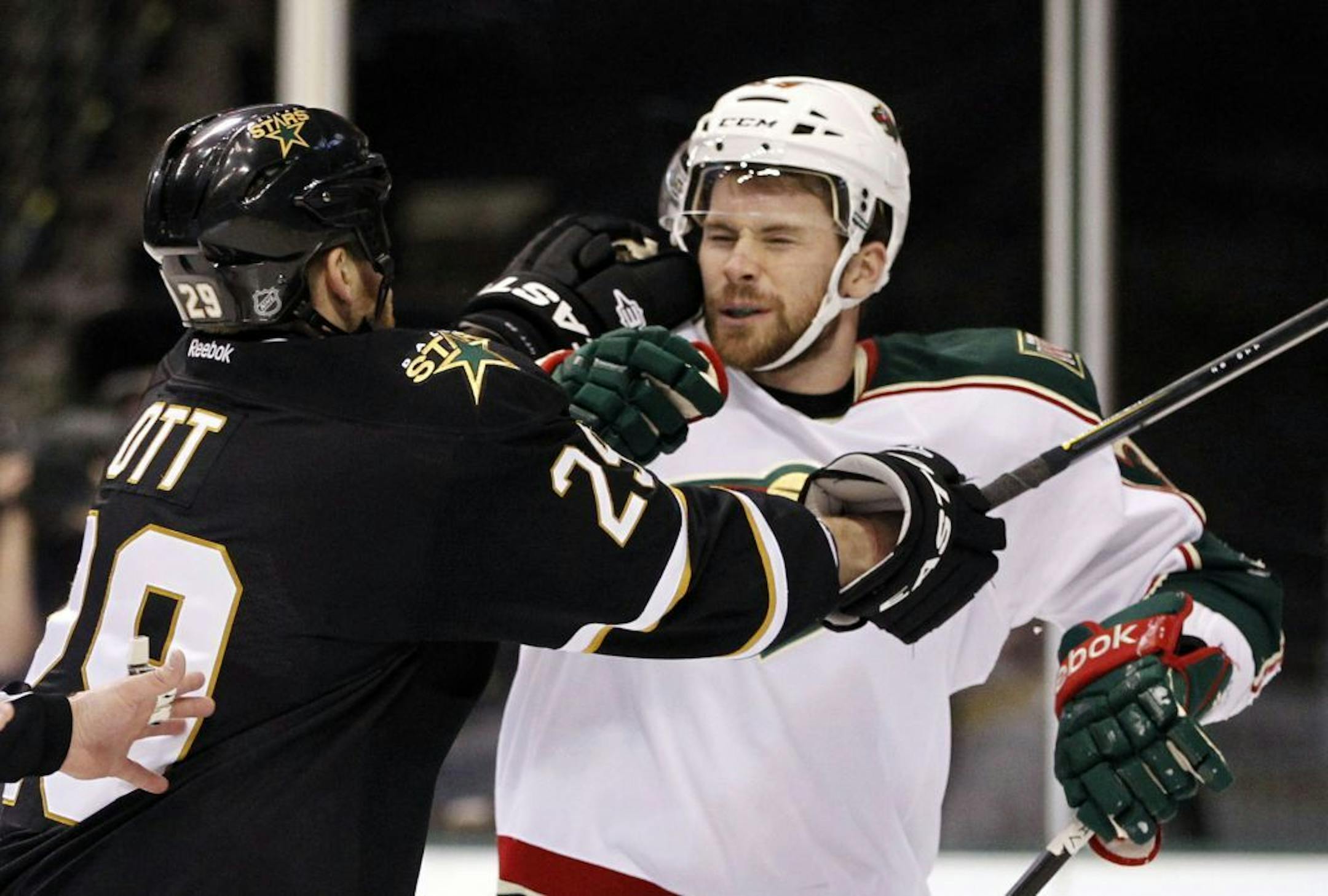 The Dallas Stars' Steve Ott (29) and the Minnesota Wild's Nate Prosser scuffle during the first period at American Airlines Center in Dallas, Texas, on Saturday, February 4, 2012.